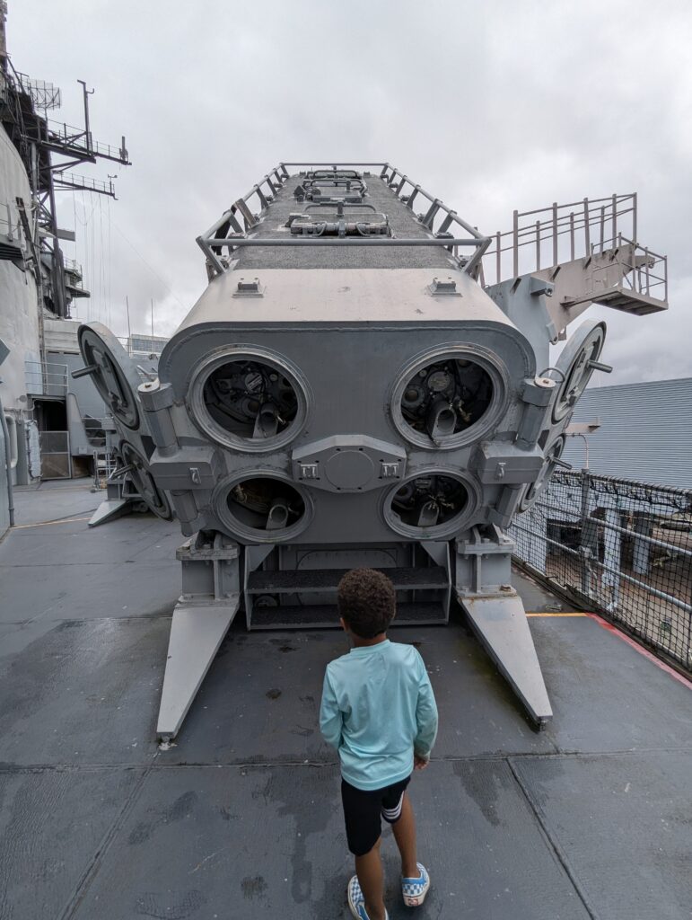 Child looking at battleship feature